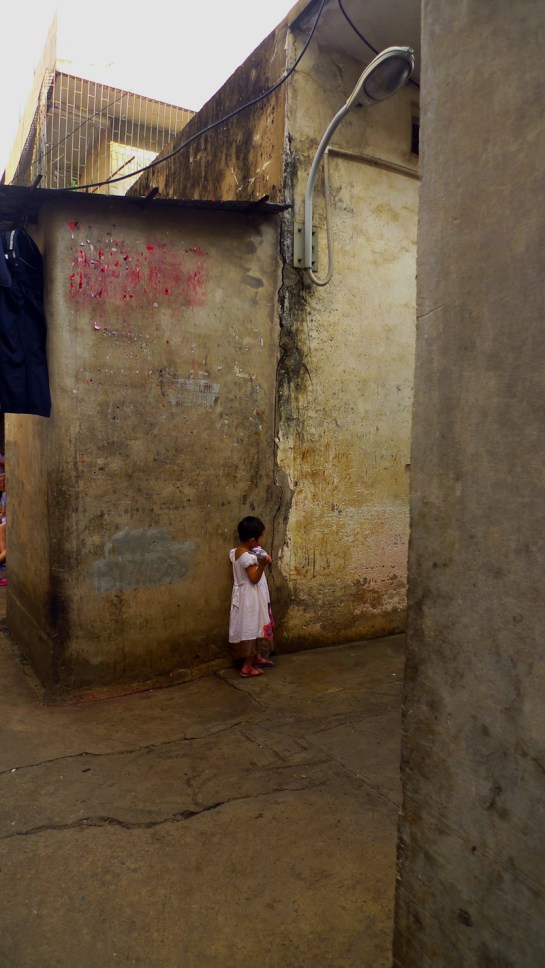 a little girl in a dubious neighbourhood
